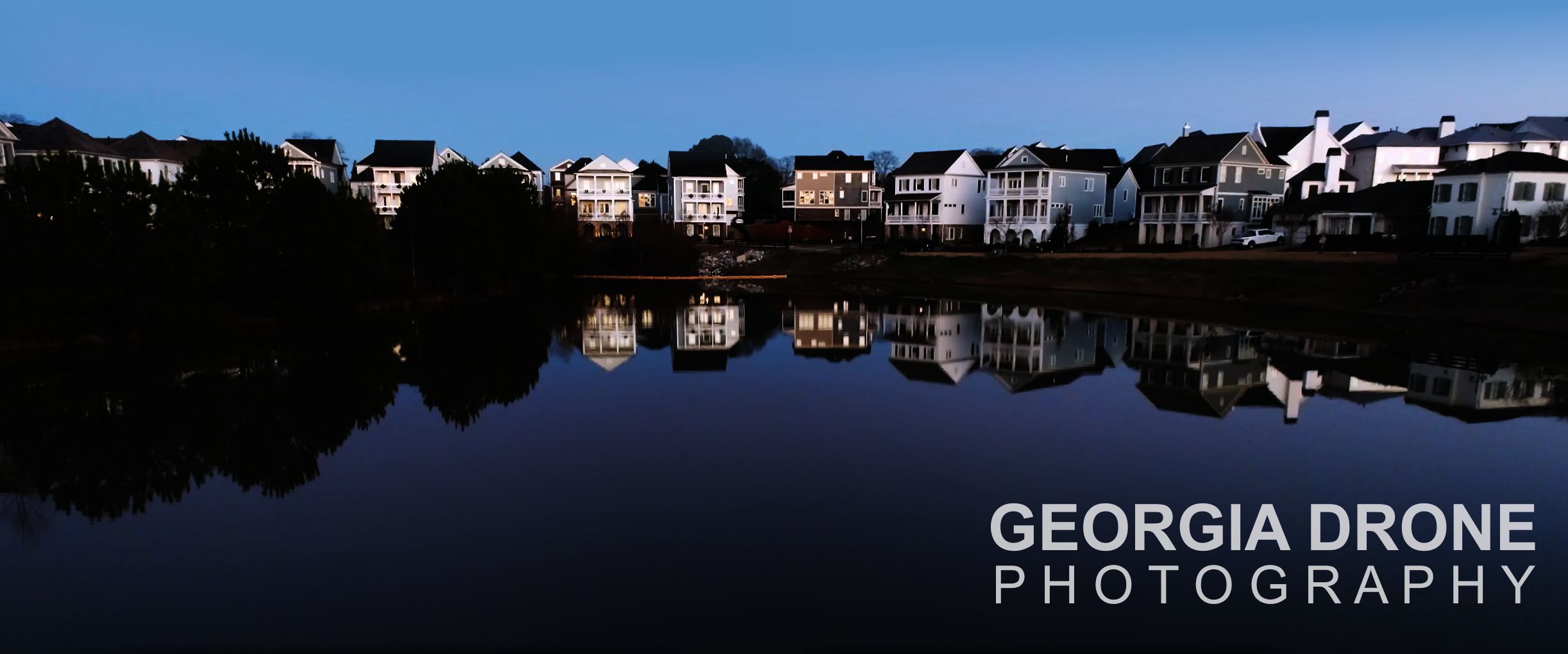 Real estate drone photography of one of two lakes in Vickery subdivision in Cumming Georgia